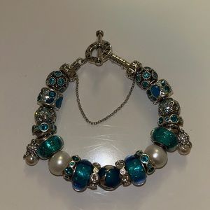 Authentic Chamilia Toggle bracelet with 22 charms